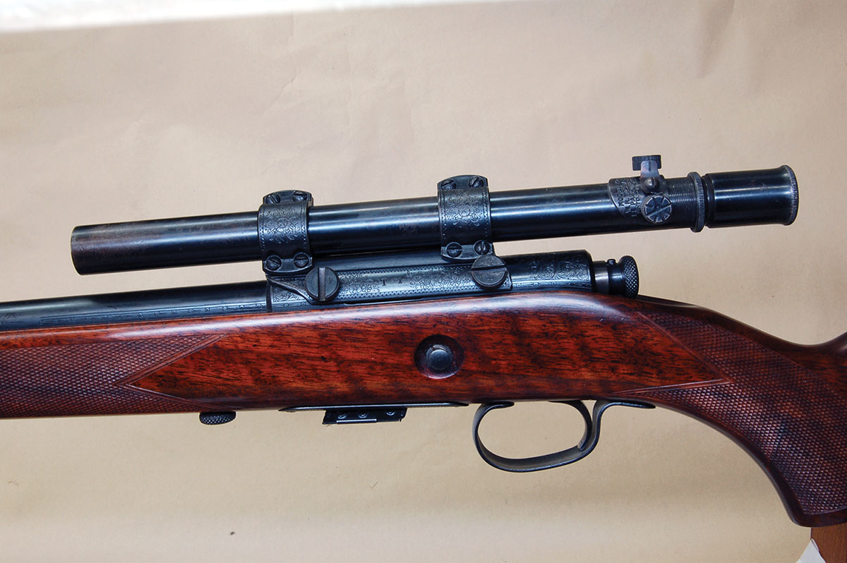 This is a classic Weaver T-side mount on a Winchester M69. The scope is a Weaver 29S from the 1940s, which is vastly superior to iron sights.